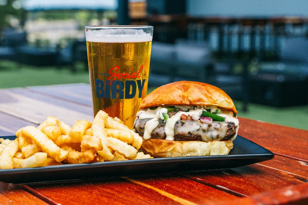 Gourmet burger and fries with Social Birdy beer