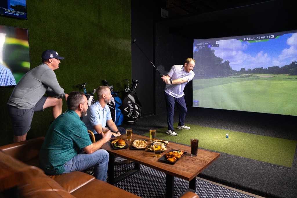 Golf simulator lounge with food and drinks at The Social Birdy